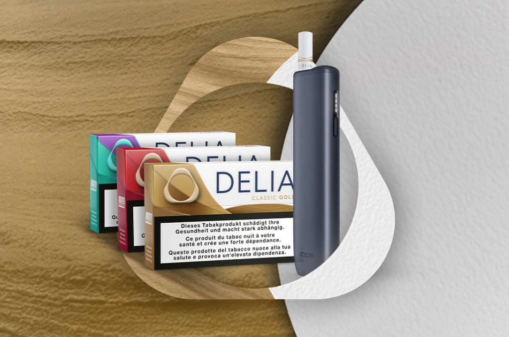 3 P&auml;ckli Terea &ndash; Sienna, Turquoise und Mauve Wave auf einem Felsen mit einem IQOS ILUMA i Ger&auml;t in Breeze Blue&nbsp;&ndash; umrahmt vom IQOS Key Visual im Tabakton.