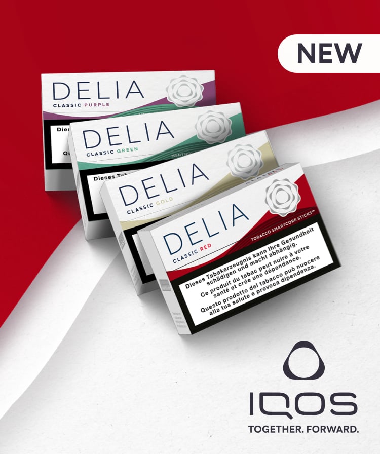 Four DELIA tobacco sticks packages and a small IQOS ILUMA device on a wavy red and white background