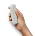 An IQOS device in a person's hand.