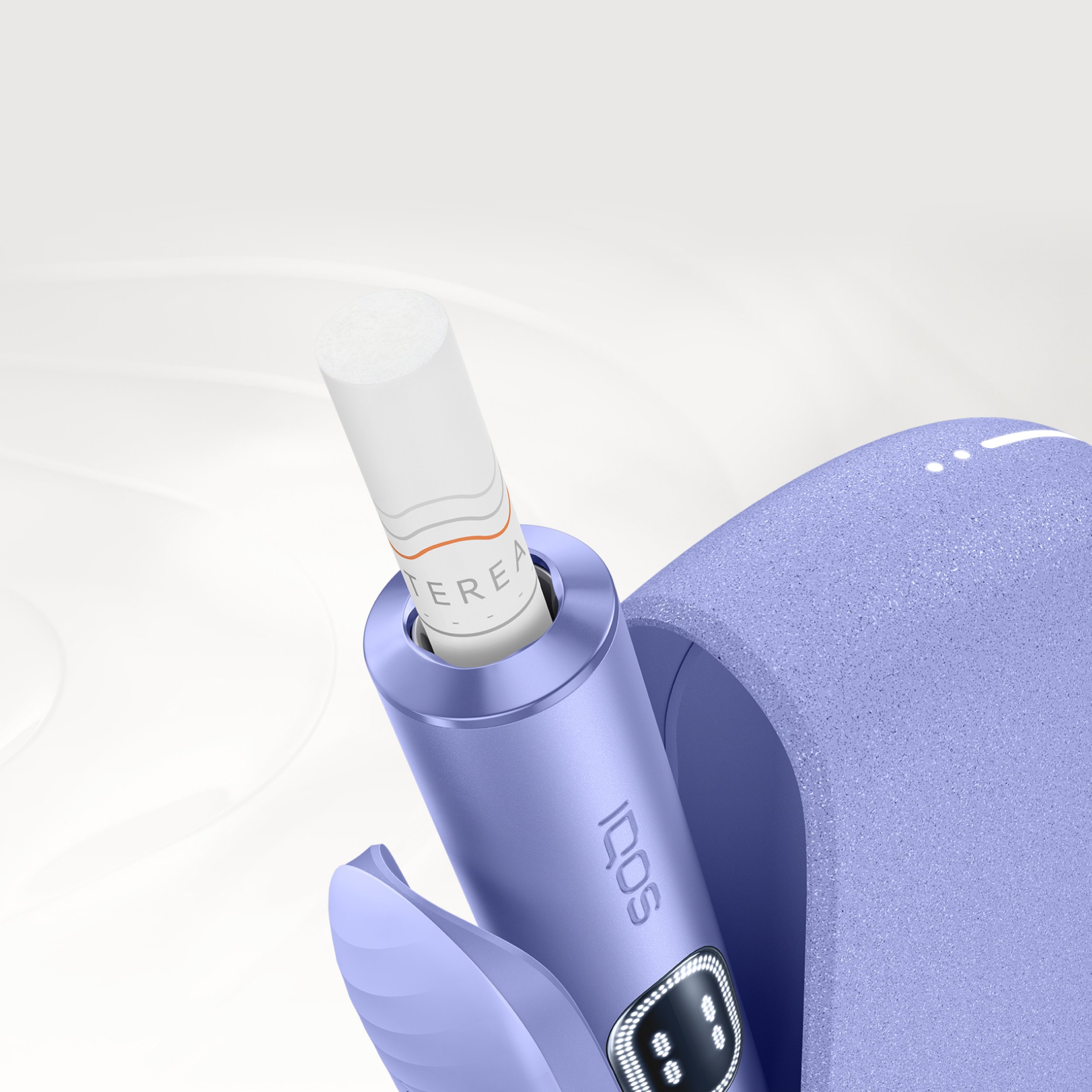 Detail of Violet IQOS ILUMA i device, with tobacco stick